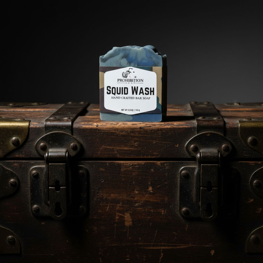 Bar of soap labeled 'Squid Wash' on a wooden chest with a dark background