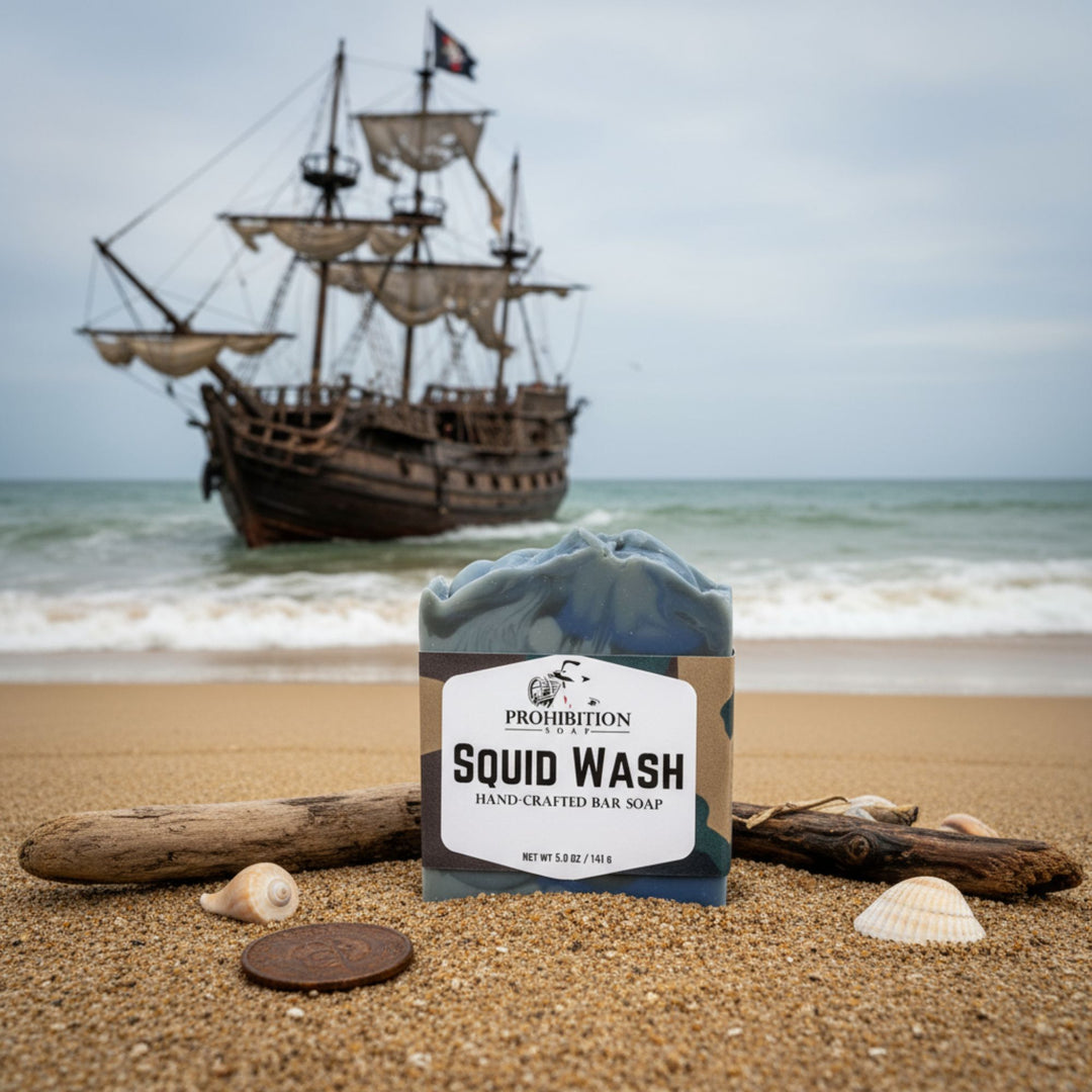 Prohibition Squid Wash bar soap on a beach with a ship in the background