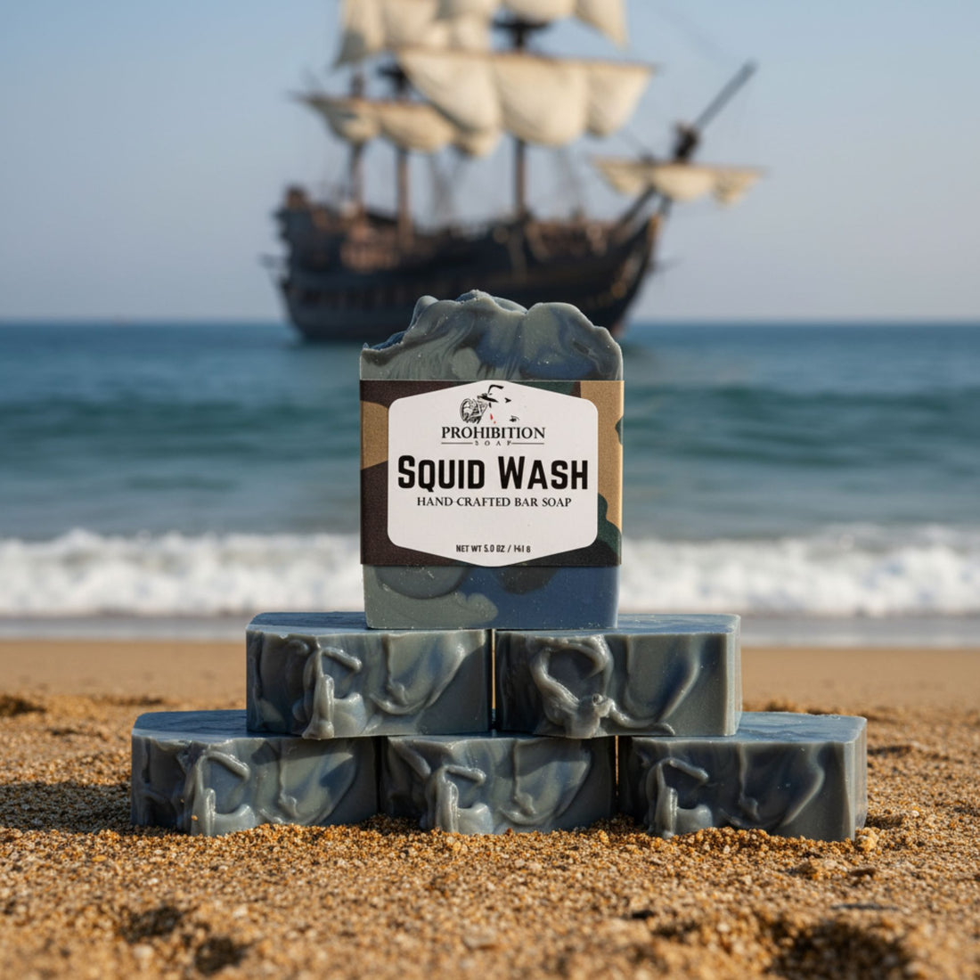 Bar of soap labeled 'Squid Wash' on a beach with a ship in the background