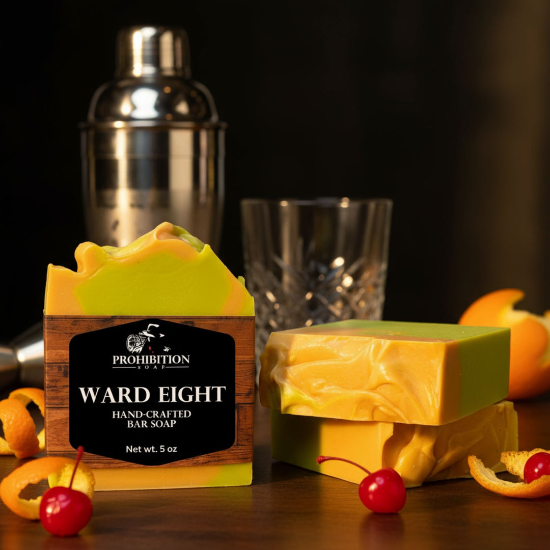 Two bars of soap with a 'Prohibition' label on a dark surface with a cocktail shaker and glass in the background.