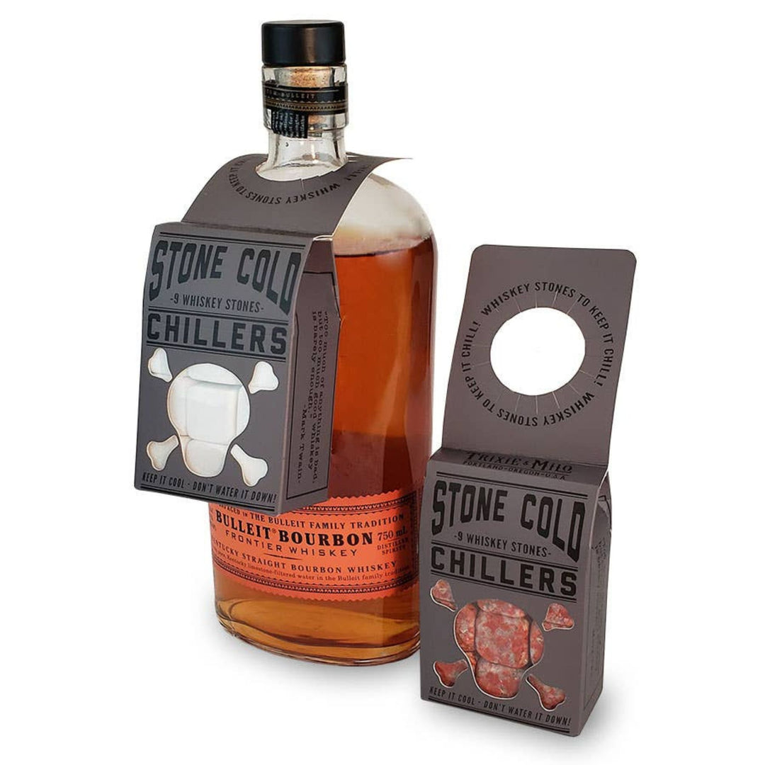Bottle of Bulleit Bourbon with Stone Cold Chillers whiskey stones packaging on a white background