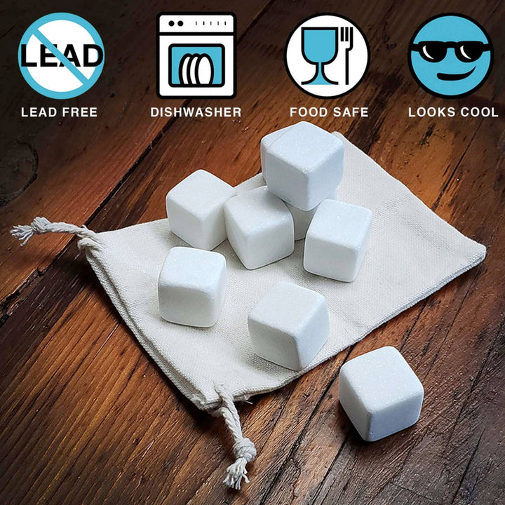 White stone-like cubes on a white cloth with certification icons for lead-free, dishwasher safe, food safe, and looks cool on a wooden background.